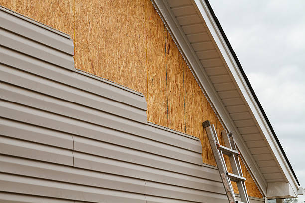 Professional Emergency Siding Repair technician working in Warfield, VA